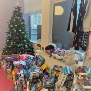 donated presents under the christmas tree