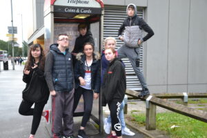 group of young people posing outside youth zone